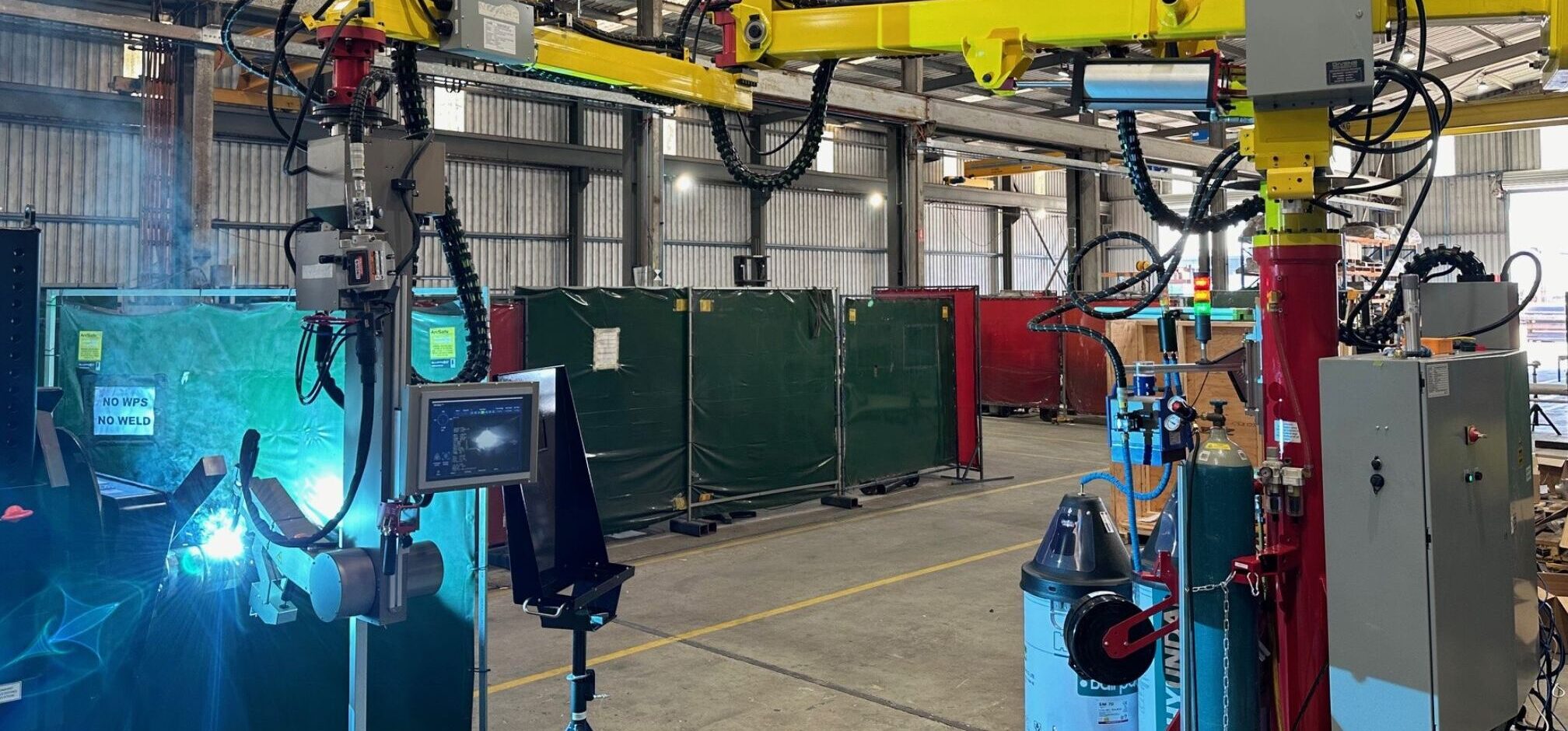 The Spool Welding Robot welding a pipe at a fabrication shop.