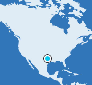 Map of North America highlighting a central location in the southern United States with a blue dot.