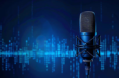 A close-up of a studio microphone with a pop filter is set against a blurred blue background with digital waveforms